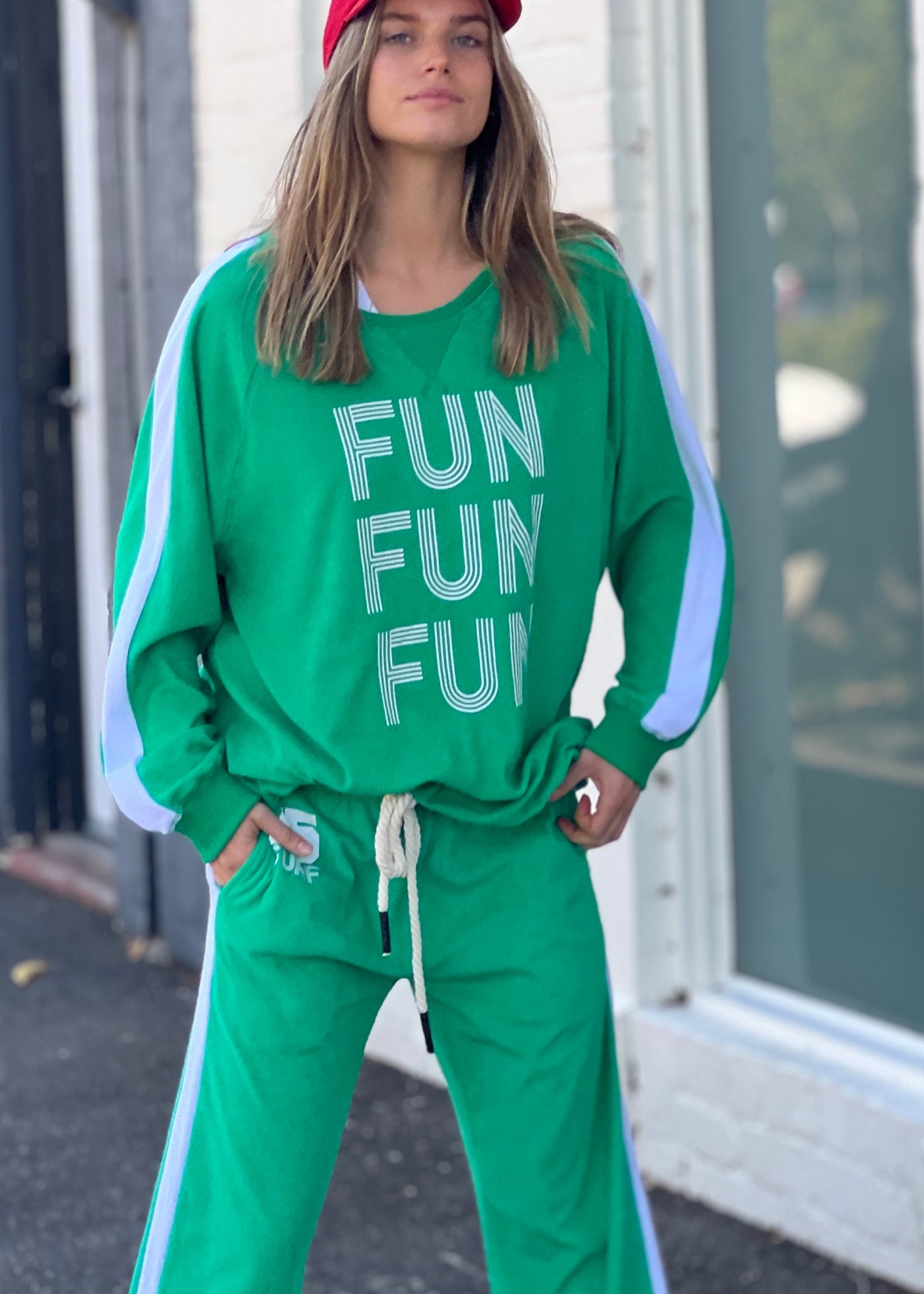 Hammill & Co lightweight, soft towelling sweat in green/white. Features our new Fun, Fun, Fun  print on the front, white panelled stripes down each sleeve, longer body length and rib waistband.