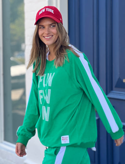 Hammill & Co lightweight, soft towelling sweat in green/white. Features our new Fun, Fun, Fun  print on the front, white panelled stripes down each sleeve, longer body length and rib waistband.