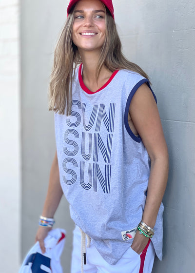 Ringer style tank in a light grey marle with contrast rib. Navy Sun, Sun, Sun print on the front with scooped hem.