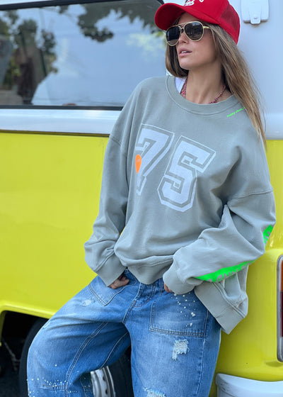 Hammill & Co longer, slouchier style sweat  in our new garment washed fleece.  Washed white 75 print on the front and neon print down the left sleeve. Pops of hot pink and neon green!
Happy vibes happy life embroidery at left side neck.  Soft 100% Washed Cotton fleece.