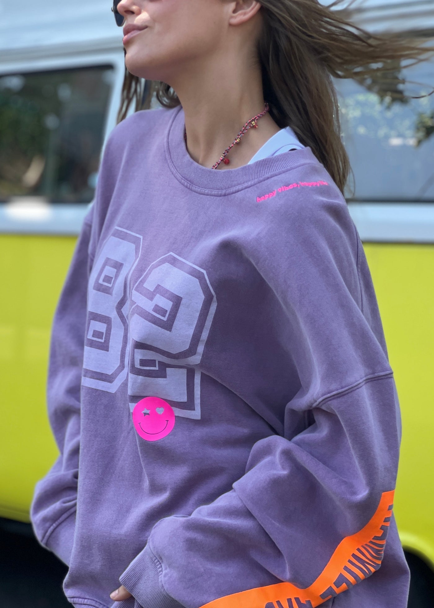 Hammill & Co  longer, slouchier style sweat  in our new garment washed fleece.  Washed white 82 print on the front and neon print down the left sleeve. Pops of hot pink and neon green! Happy vibes happy life embroidery at left side neck. 
Soft 100% Washed Cotton fleece. 