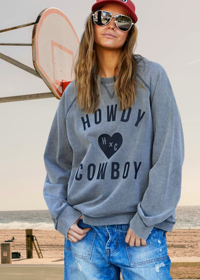 Hammill & Co wash sweats are unique, have a worn-in look and
comfortable feel. The vintage wash process involves treating the fabric to give
it a faded, slightly distressed appearance, reminiscent of well-loved garments.
Washed vintage black with black Howdy Cowboy print on the front.
