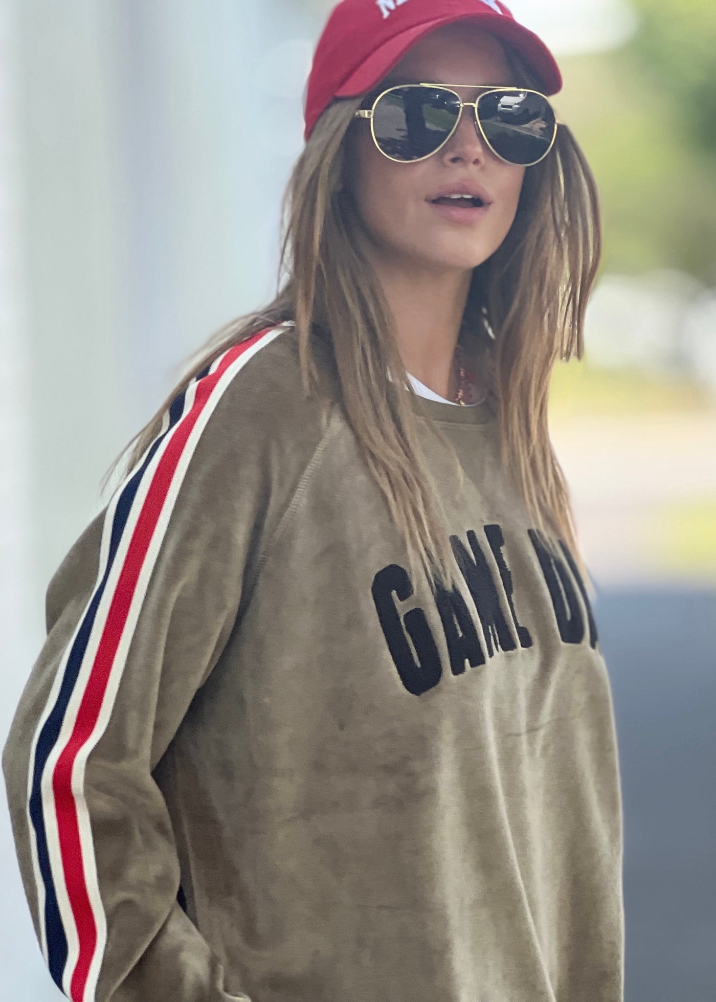 Hammill & Co slouchy sporty velour sweat in soft khaki with stripe tape down each sleeve and black Game Day chenille applique on the front. Looks great worn with the matching tracky pants or back with casual jeans