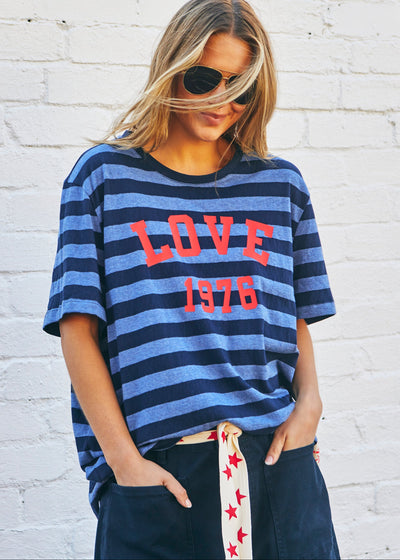 Hammill & Co bold navy and blue stripes and a pop of red“LOVE 1976” across the front.