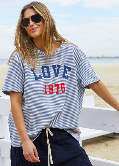 Hammill & Co tee is a total throwback in the best way. With fine navy and white stripes and a pop of red“1976 LOVE” across the front.