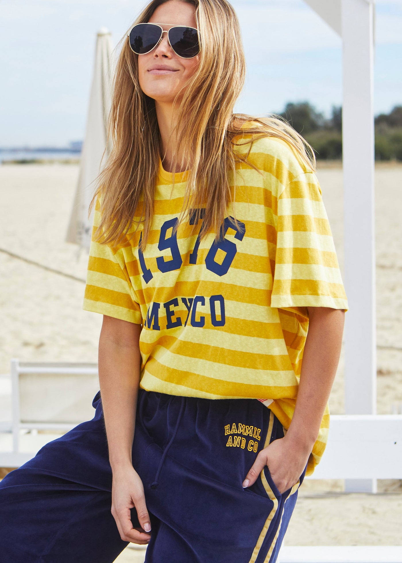 Hammill & Co Slouchy crew neck tee in a soft yellow and mustard stripe jersey with navy retro Mexico print on the front. Looks great worn back with the velour pants and shorts!