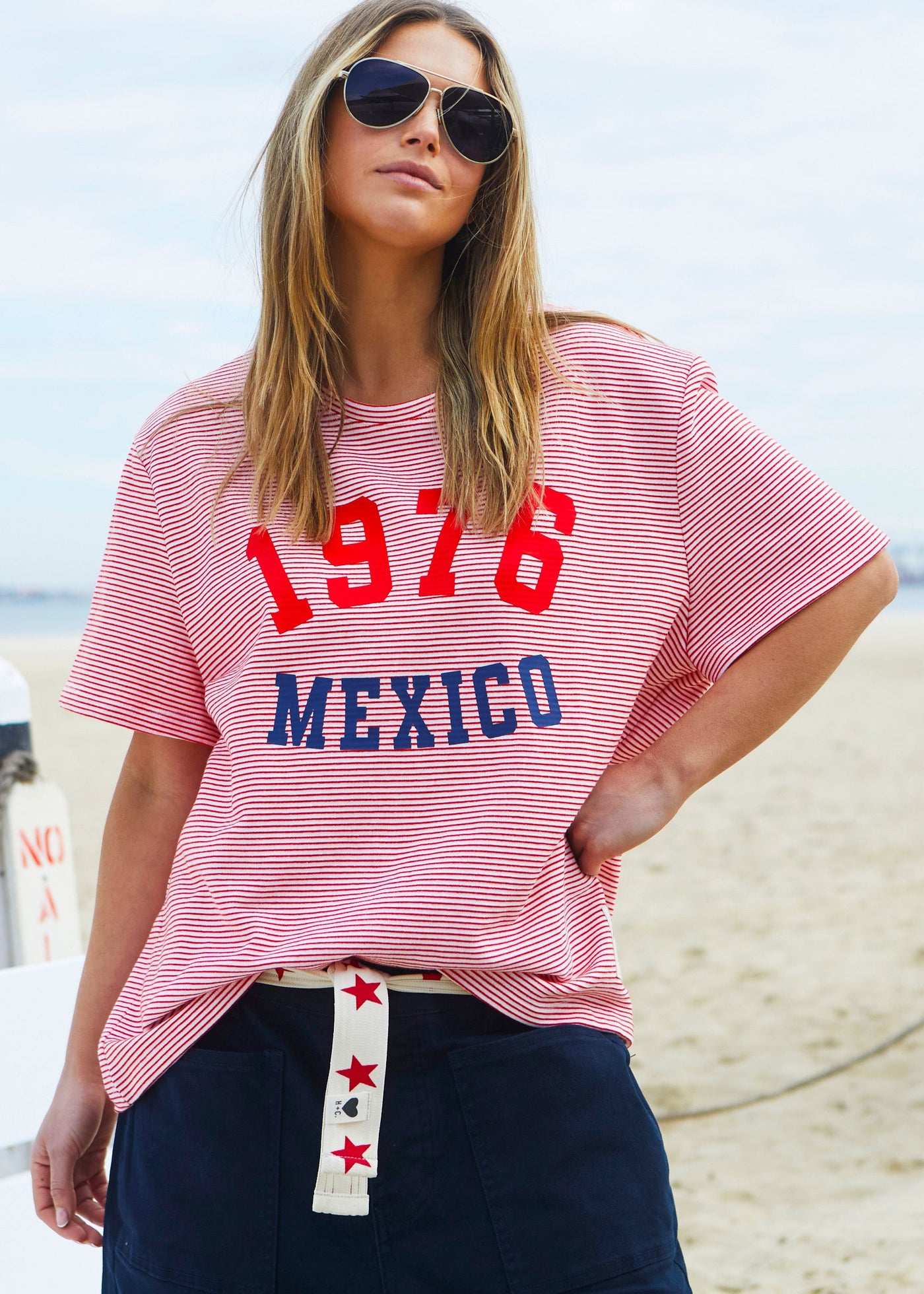 Hammill & Co tee is a total throwback in the best way. With fine red and white stripes and a pop of red and navy “1976 MEXICO” across the front.