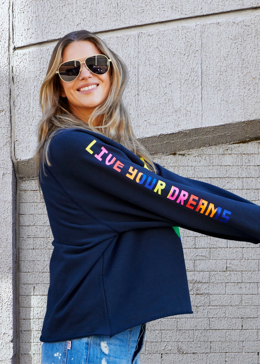 Hammill & Co Dark navy with multi coloured heart print on the front and multi coloured FOLLOW YOUR DREAMS down the right sleeve.