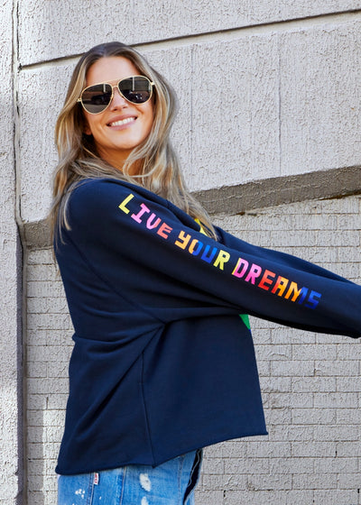 Hammill & Co Dark navy with multi coloured heart print on the front and multi coloured FOLLOW YOUR DREAMS down the right sleeve.