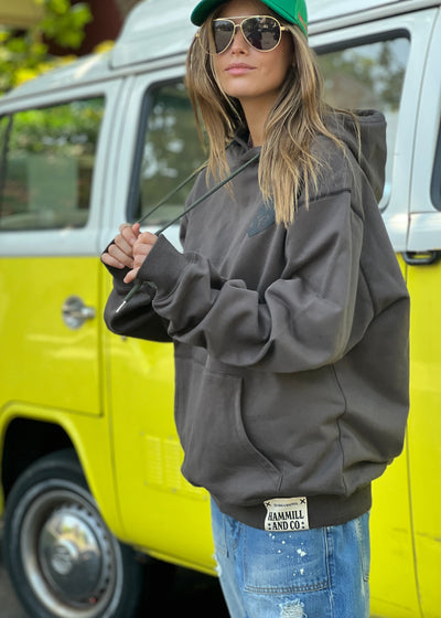 Hammill & Co Slouchy hoody with front pocket is featured in a soft unbrushed cotton with contrast white stitching around the sleeve.
Fit:Slouchy wider and longline silhouette
Features: Front kanga pocket, small puff print heart on the front left chest and larger puff print on the back featuring H&C.