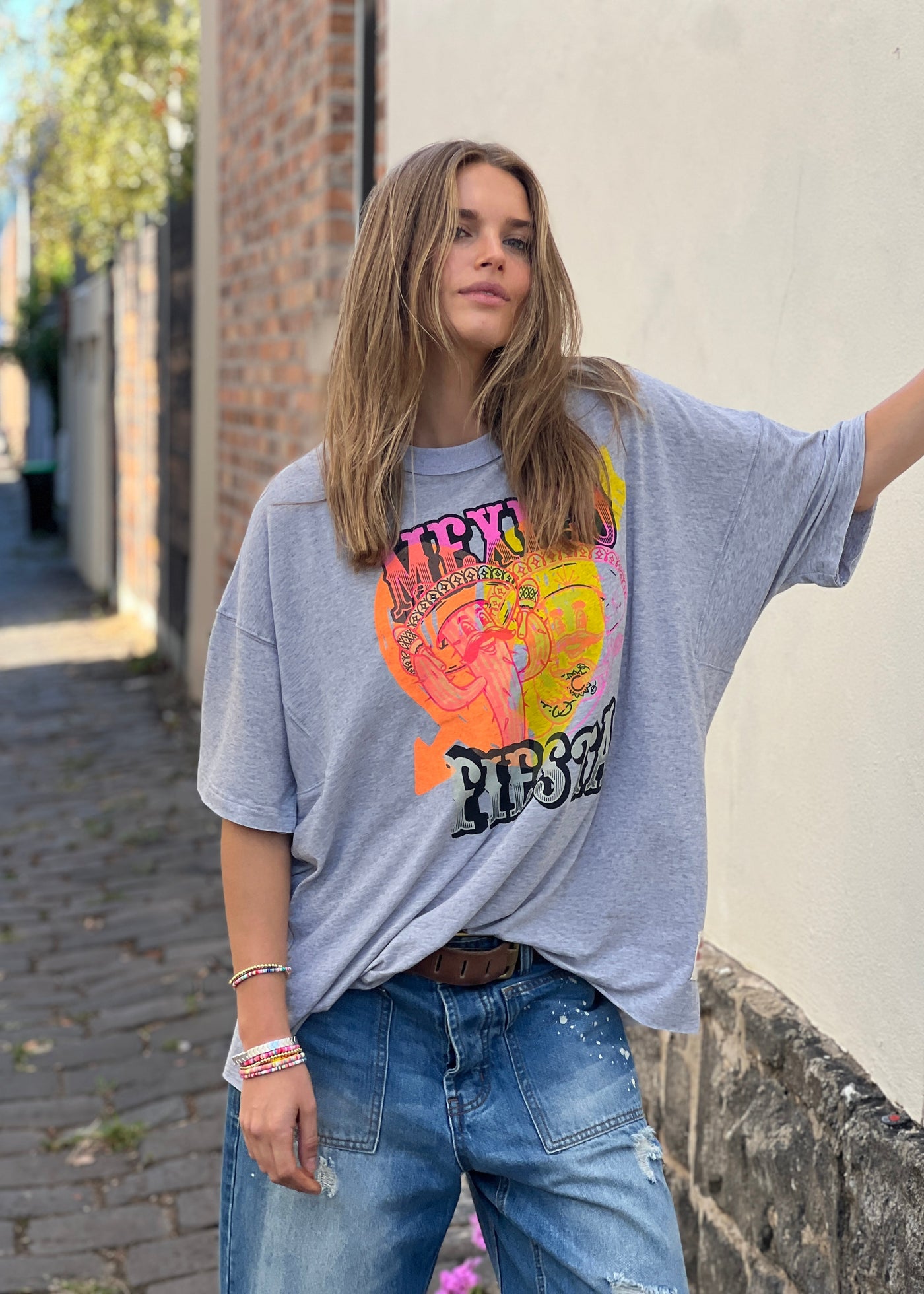 Hammill & Co oversized fit tee in a washed light grey marle colour with multi coloured print o the front. Slouchy wider fit, drop longer sleeve and cut raw hem.