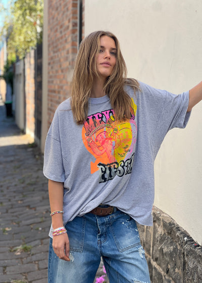 Hammill & Co oversized fit tee in a washed light grey marle colour with multi coloured print o the front. Slouchy wider fit, drop longer sleeve and cut raw hem.