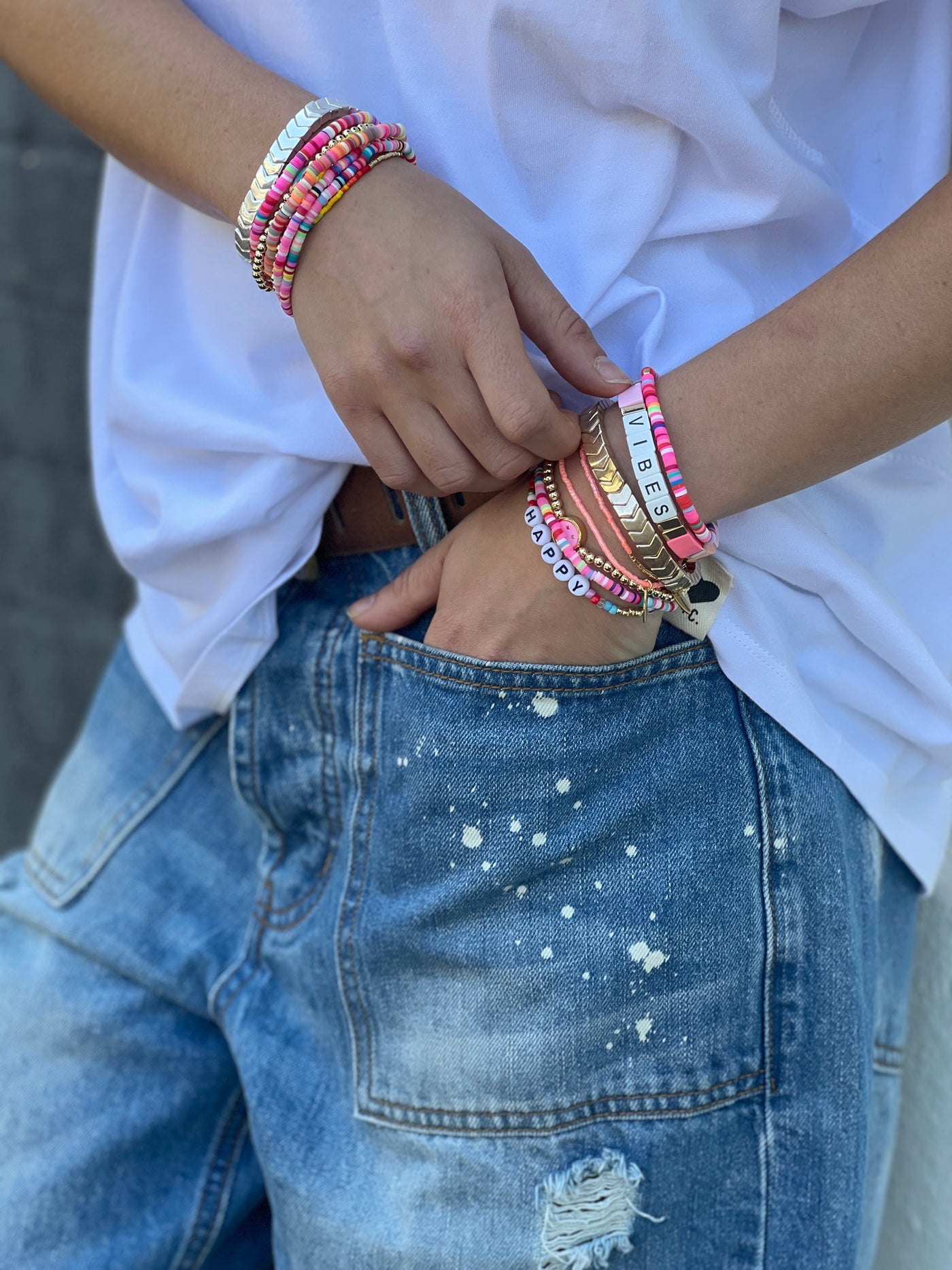 Hammill & Co Colourful set of 8 pink bracelets.  Features Vibes beaded bracelet, multi cube enamel bracelets,  Happy bracelet and mixed fine beaded ones.

