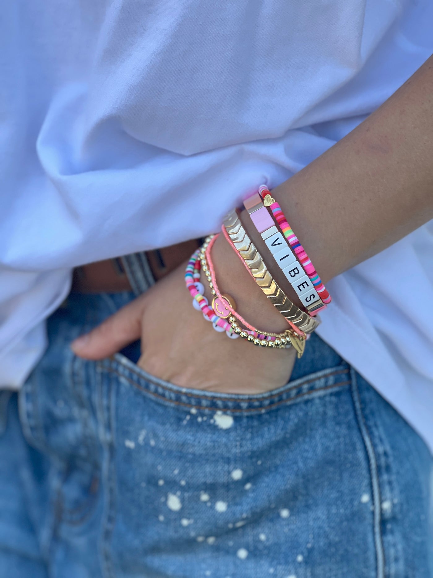 Hammill & Co Colourful set of 8 pink bracelets.  Features Vibes beaded bracelet, multi cube enamel bracelets,  Happy bracelet and mixed fine beaded ones.

