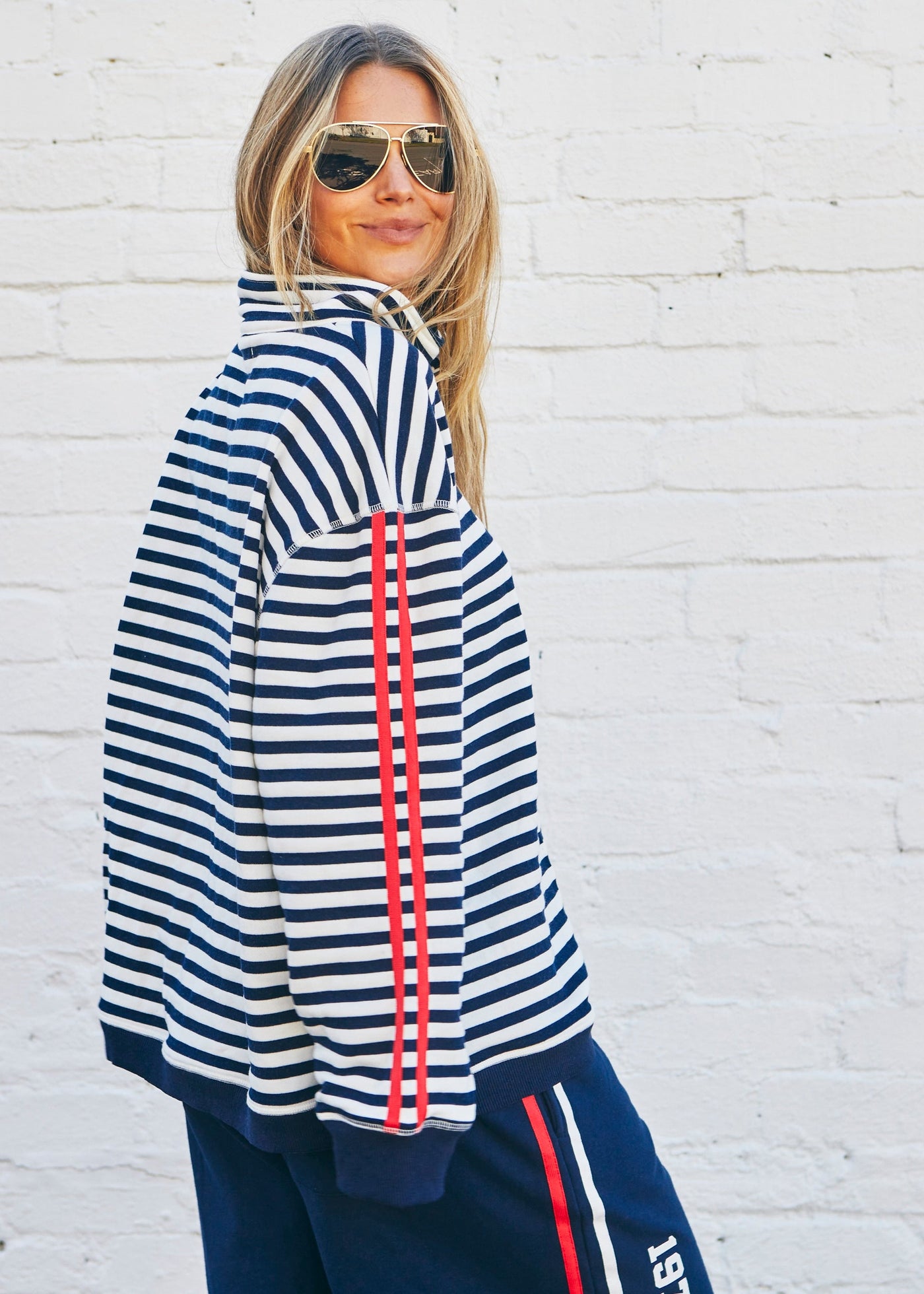 Hammill & Co Our newest sweat  features open collar with zip detail, slight drop sleeve, sporty stripes and straight raw-cut hem. This fit is relaxed, wider body but still enough length for good coverage!