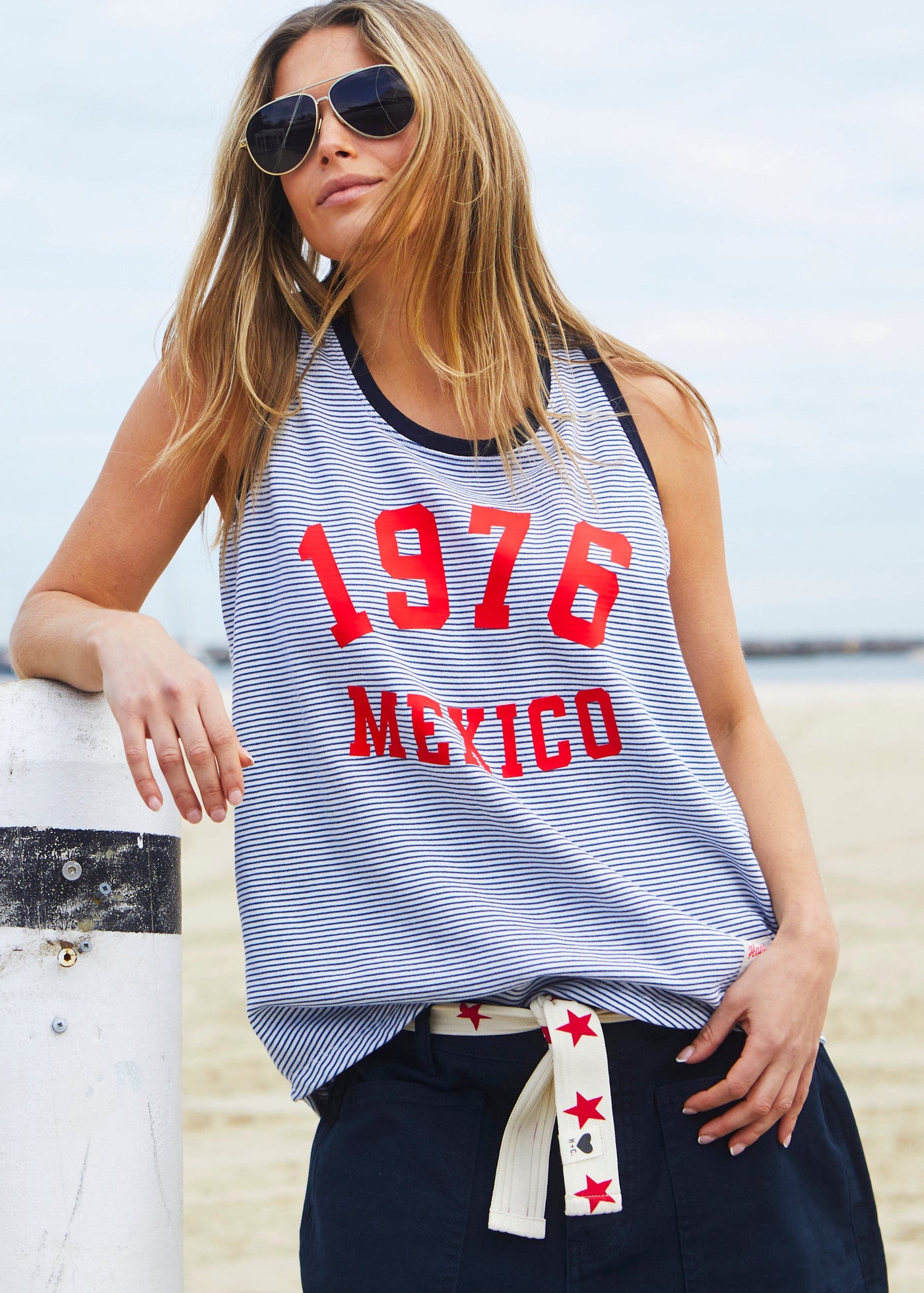 Hammill & Co Retro stripe tank in soft cotton navy and white fine stripe with navy rib. Red retro print 1976 MEXICO on the front.