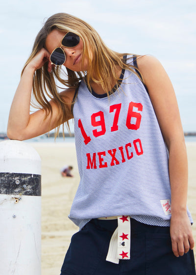 Hammill & Co Retro stripe tank in soft cotton navy and white fine stripe with navy rib. Red retro print 1976 MEXICO on the front.