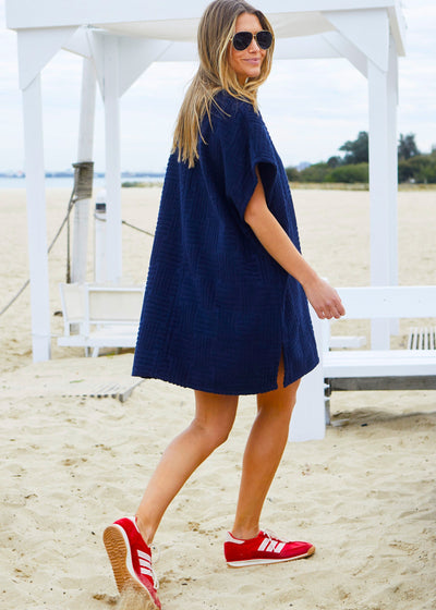 Hammill & Co towelling dress is a relaxed, oversized beach cover-up crafted from soft, textured terry fabric. 