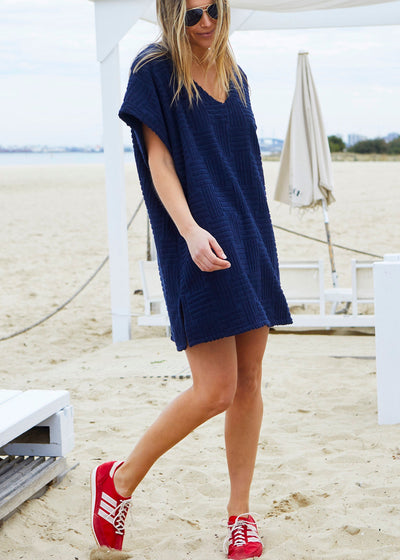 Hammill & Co towelling dress is a relaxed, oversized beach cover-up crafted from soft, textured terry fabric. 