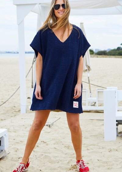 Hammill & Co towelling dress is a relaxed, oversized beach cover-up crafted from soft, textured terry fabric. 