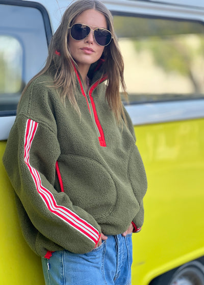 Hammill & Co Soft and cozy Khaki 1/2 zip polar fleece sweat. Featuring stripe tape down each sleeve, contrast placket and front zipper, slouchy pockets with red zips, adjustable waistband with elastic and toggle and higher neck style for extra warmth.