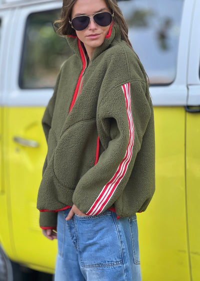 Hammill & Co Soft and cozy Khaki 1/2 zip polar fleece sweat. Featuring stripe tape down each sleeve, contrast placket and front zipper, slouchy pockets with red zips, adjustable waistband with elastic and toggle and higher neck style for extra warmth.