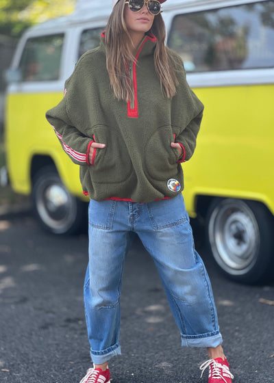 Hammill & Co Soft and cozy Khaki 1/2 zip polar fleece sweat. Featuring stripe tape down each sleeve, contrast placket and front zipper, slouchy pockets with red zips, adjustable waistband with elastic and toggle and higher neck style for extra warmth.