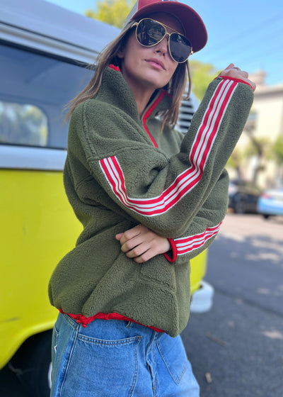 Hammill & Co Soft and cozy Khaki 1/2 zip polar fleece sweat. Featuring stripe tape down each sleeve, contrast placket and front zipper, slouchy pockets with red zips, adjustable waistband with elastic and toggle and higher neck style for extra warmth.