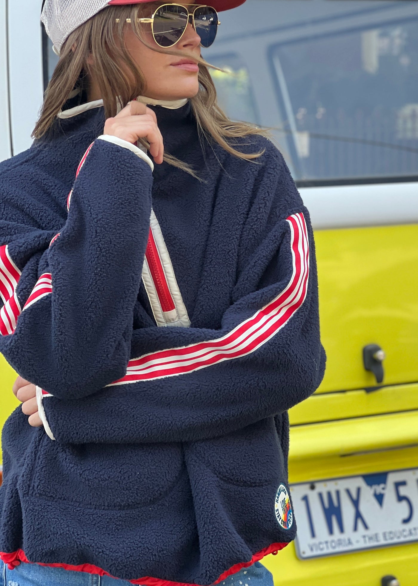 Hammill & Co Soft and cozy Navy 1/2 zip polar fleece sweat. Featuring stripe tape down each sleeve, contrast placket and front zipper, slouchy pockets with red zips, adjustable waistband with elastic and toggle and higher neck style for extra warmth.