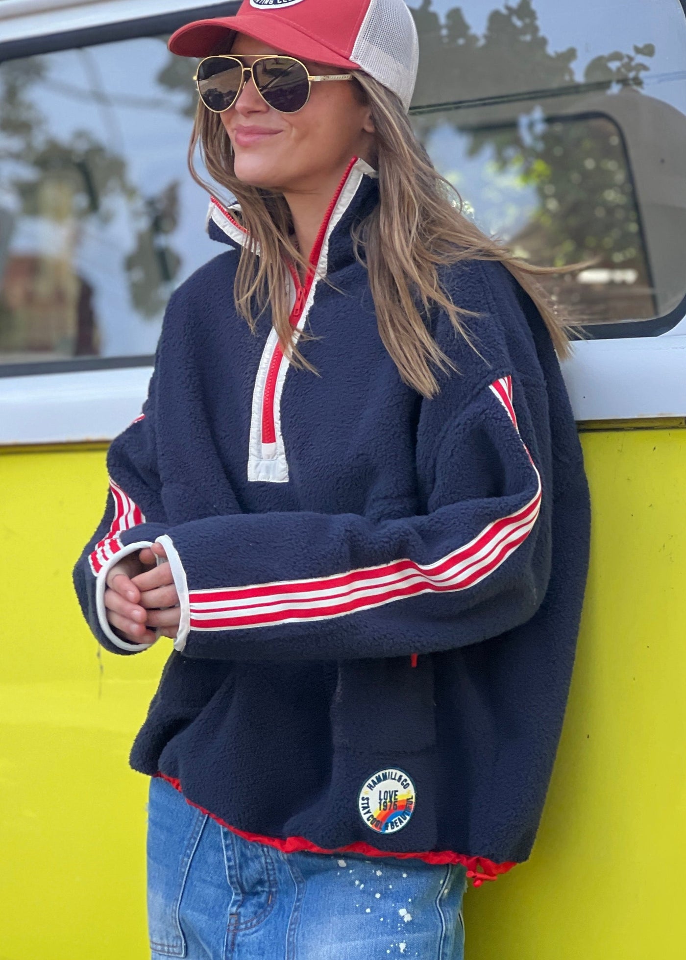 Hammill & Co Soft and cozy Navy 1/2 zip polar fleece sweat. Featuring stripe tape down each sleeve, contrast placket and front zipper, slouchy pockets with red zips, adjustable waistband with elastic and toggle and higher neck style for extra warmth.