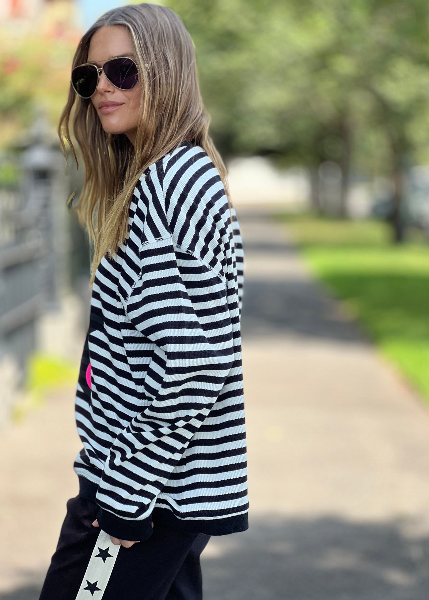 Hammill & Co Black and white stripe rib waffle top with contrast black rib collar and cuffs. New Star and smiling print on the front.