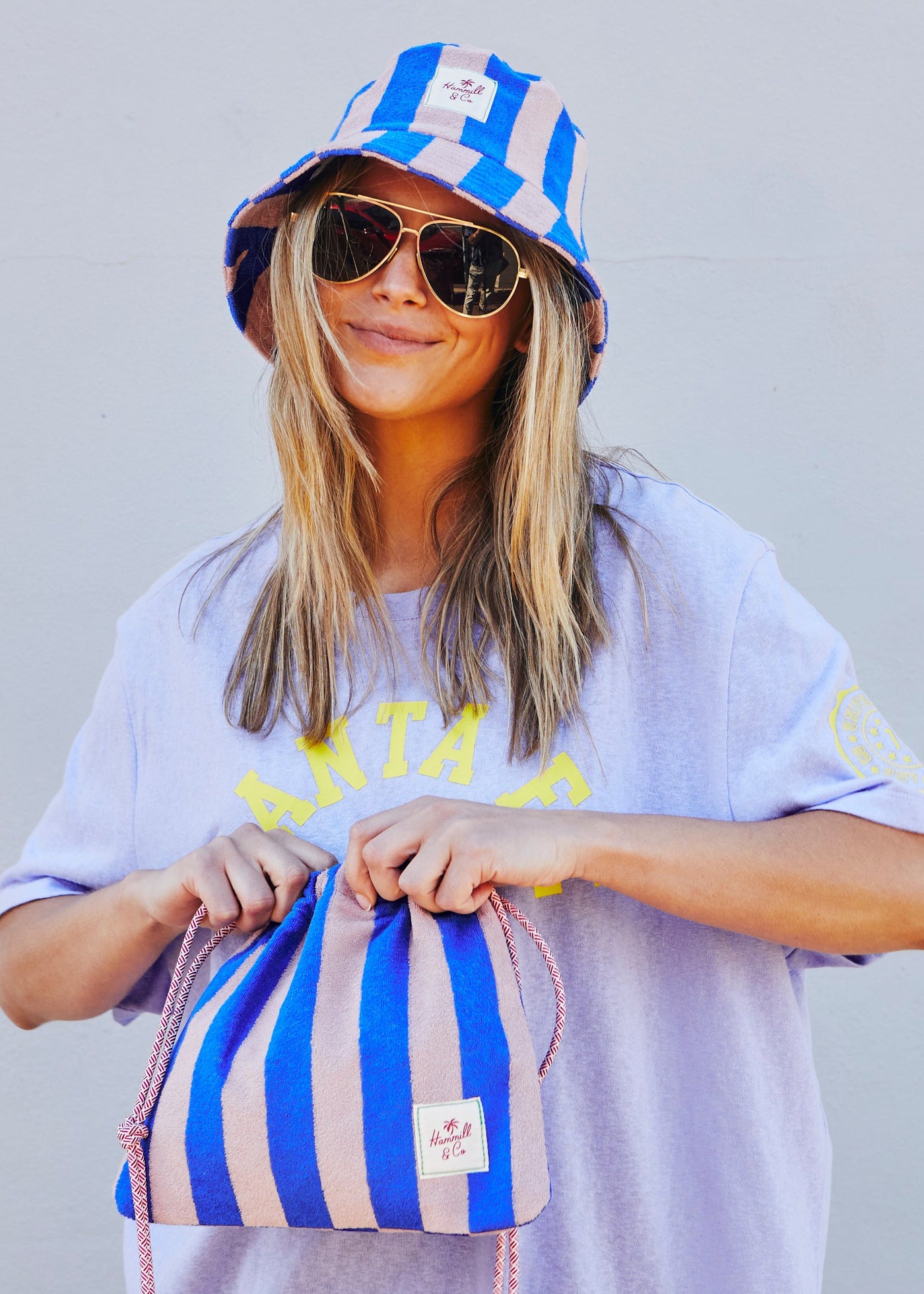 Hammill & Co bold striped bucket hat is pure summer happiness. Made from soft terry towelling in vibrant Royal and musk stripes.