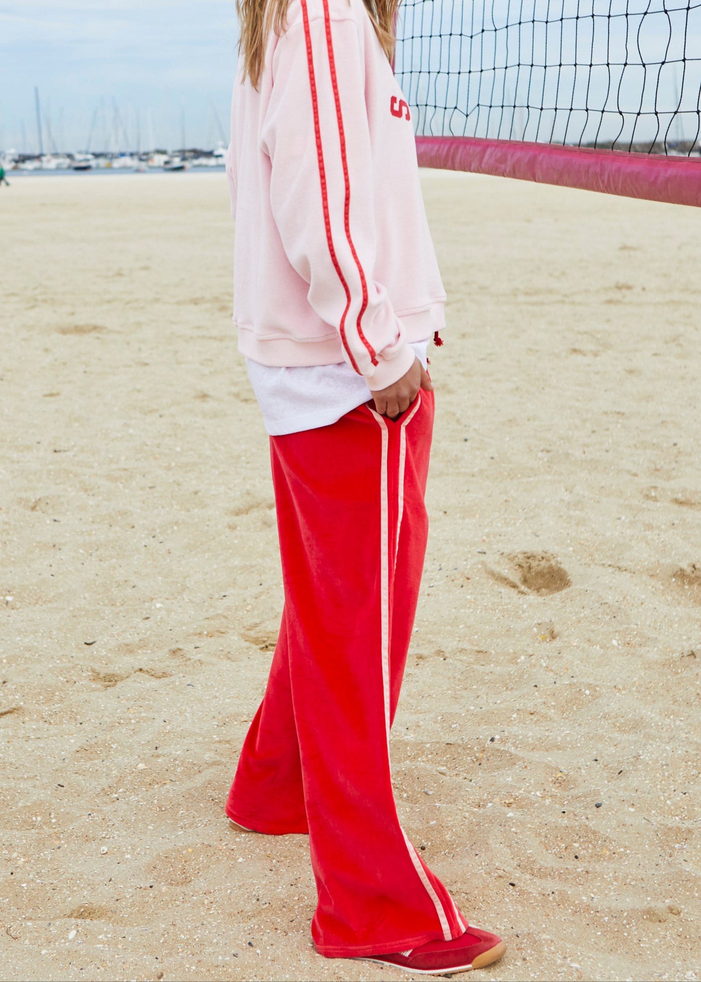 Hammill & Co New wider leg track pant in our luxurious, lightweight velour with velour stripes down each leg, draw cord and Hammill and Co logo print on left hem. The fit is a true to size, not oversized.