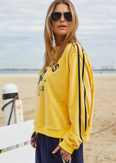 Hammill & Co Our standard fitting sweat with rib neck and waistband. Navy St. Louis retro print on the front and double navy velour tape down each sleeve.