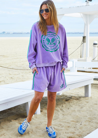 Hammill & Co Our standard fitting sweat with rib neck and waistband. Retro tennis print on the front and double green velour tape down each sleeve.
