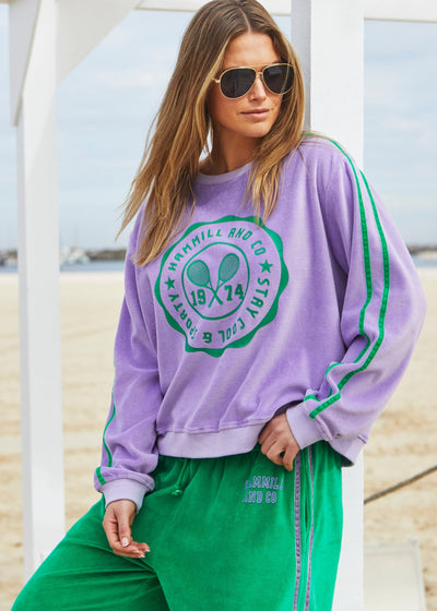 Hammill & Co Our standard fitting sweat with rib neck and waistband. Retro tennis print on the front and double green velour tape down each sleeve.