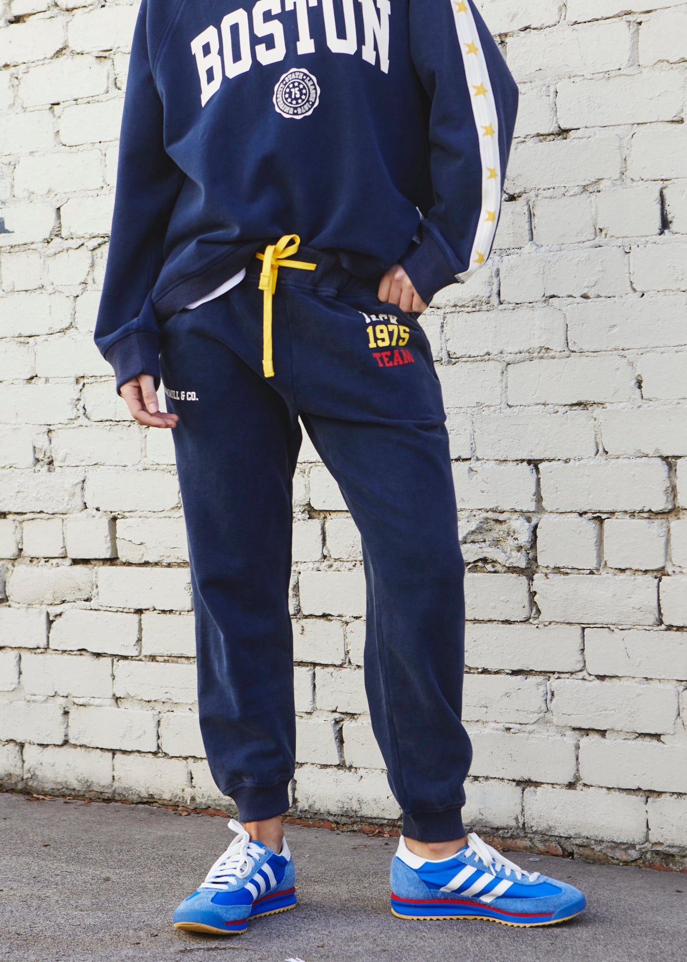 Hammill & Co College navy track pant in heavy stonewash fleece to give a well loved, worn-in look!