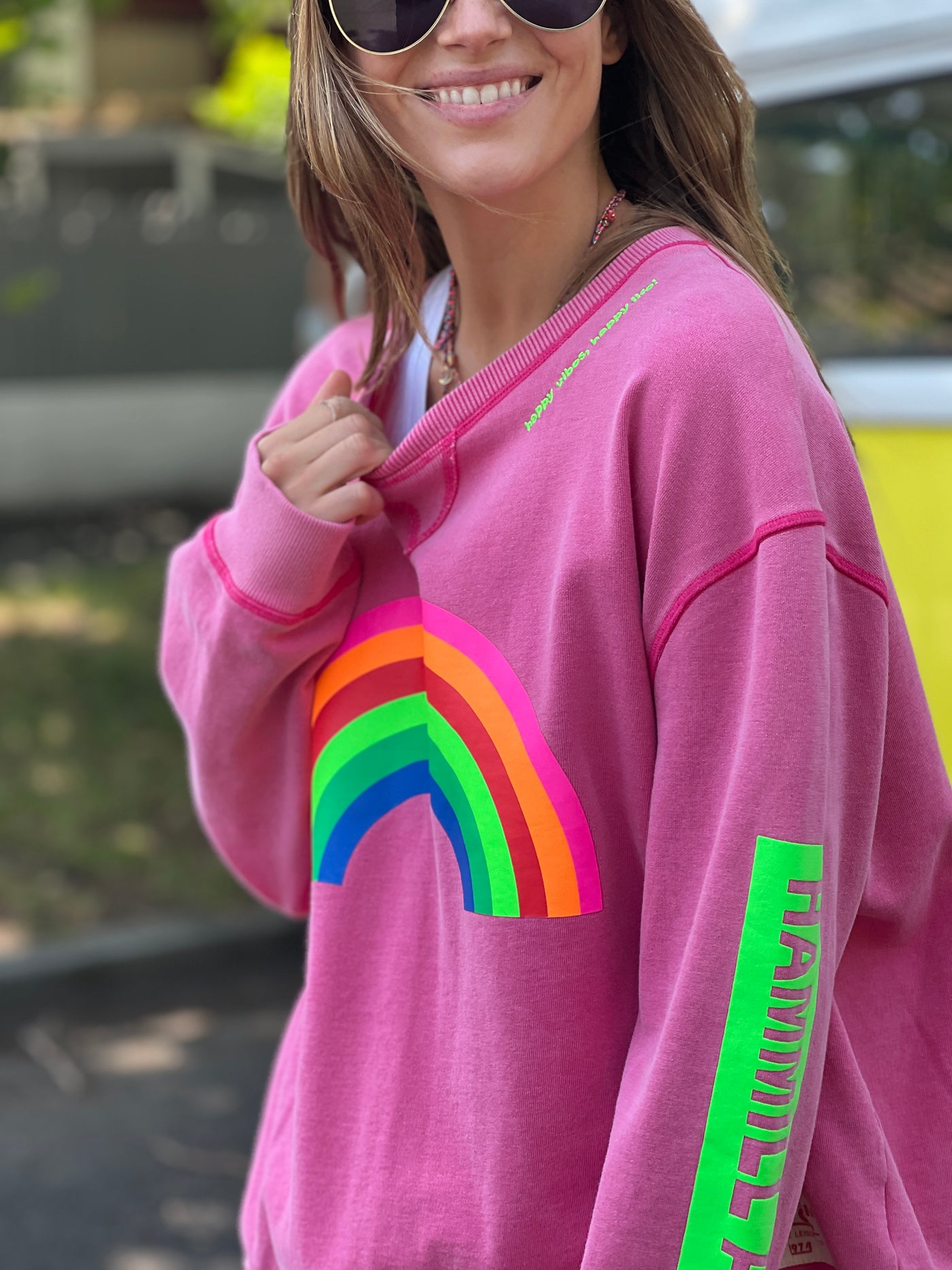 featured in a slouchy, crewneck silhouette with multi coloured rainbow print on the front and bold  Hammill & Co logo down the left sleeve. 