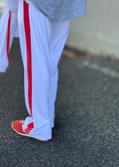 Hammill & Co lightweight terry towelling with white panelled stripes down each leg and white hip print. It has an elastic waistband with a chunky draw cord. The hem has a light overlocked stitch and comfy concealed side pockets.